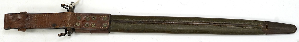 An American 1917 Remington bayonet, based on the earlier British bayonet of 1913, adapted for the 0.3 to 0.6 calibre rifles, with its leather covered scabbard. Condition - good